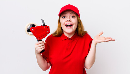 red head pretty woman feeling happy, surprised realizing a solution or idea. packer employee concept