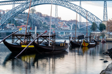 Portugal, Porto, Luis I Bridge and traditionalÊrabeloÊboats on Douro river
