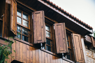 open wooden shutters on wooden windows in a Turkish house.