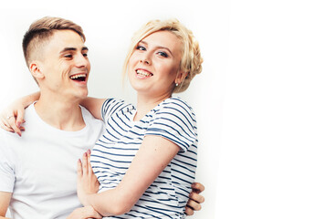 Fototapeta premium young pretty teenage couple, hipster guy with his girlfriend happy smiling and hugging isolated on white background, lifestyle people concept