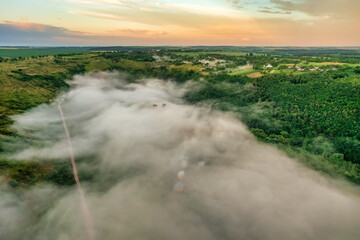 Aerial view drone shot of mountain tropical rainforest,Bird eye view image over the clouds Amazing nature background with clouds and mountain peaks