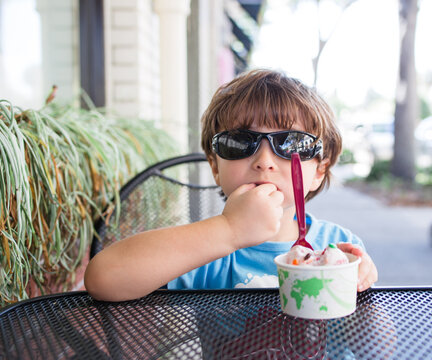 Kid having ice-cream in winter park Florida  stock photo royalty free