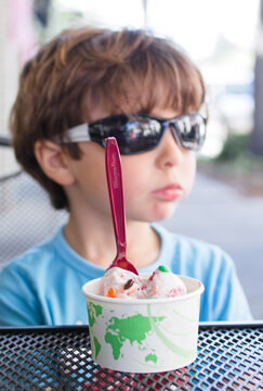 Kid having ice-cream in winter park Florida  stock photo royalty free