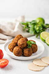 Bowl of fried falafel. Middle eastern traditional snack. Side and Close-up view