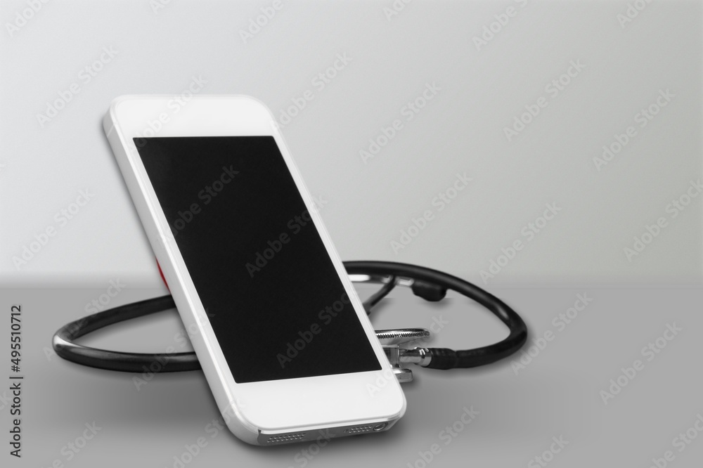 Poster Online doctor concept. Phone with medical stethoscope