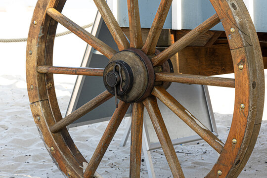 Closeup image of a vintage carriage wheel.