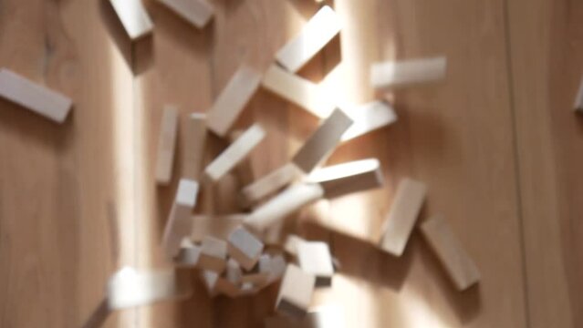 Destruction of a tower built of many wooden blocks