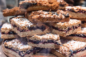 Close-up, pieces of grated pie on a shop window.
