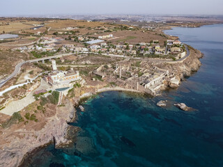 Fototapeta na wymiar Aerial drone. Rocky coastline and island at Portopalo di Capo Passero, Siracusa Province, Sicily.