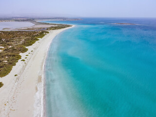 Aerial drone. Beautiful crystal clear water and sandy beach. Cittadella dei Maccari, San Lorenzo, Nature Reserve Oasis of Vendicari, Sicily near Noto.