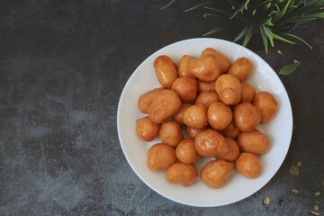 A bowl of Lokma (Turkish), loukoumades (Greeek ) with other names in other languages, are pastries...