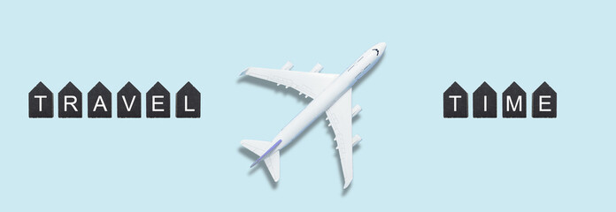 Airplane model. White plane on background. Travel vacation concept. Summer background. Flat lay, top view, copy space.