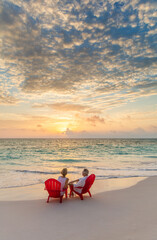 Fototapeta na wymiar Retired Caucasian couple on beach at sunset Bahamas