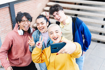 University Student Friends having fun laughing and taking a selfie photo to celebrate achievement