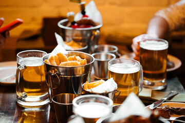 Table set with beer and salty snacks in a pub