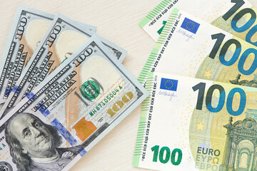 Fototapeta na wymiar Several dollars and euros bills background on table. Currency background. Heap of american dollars and europe euro. Currency exchange concept. top view.
