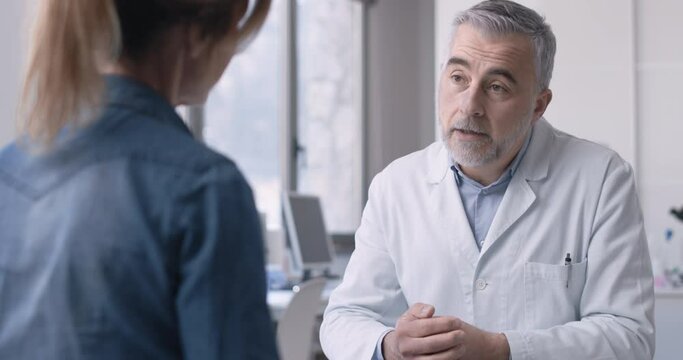 a primary care physician receives a patient in his office