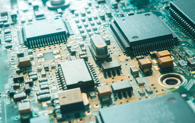 Computer Microchips and Processors on Electronic circuit board.  Computer hardware technology. Abstract technology microelectronics concept background. Macro shot, shallow focus.