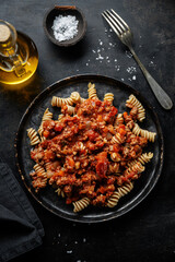 Pasta bolognese with vegetables on plate