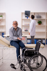 Old injured man visiting young male doctor radiologist