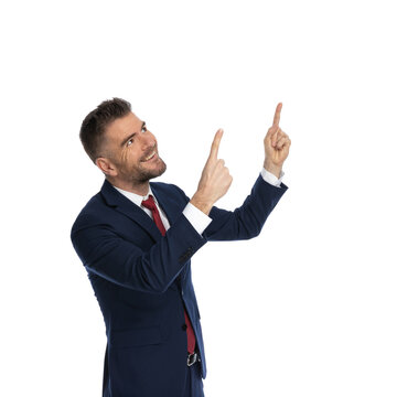 businessman pointing up to God with grattitude