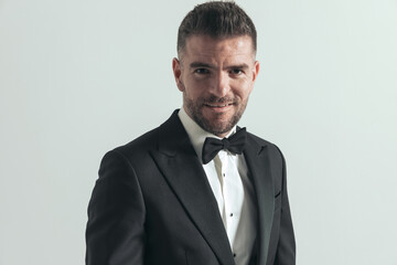 businessman smiling at the camera and feeling happy