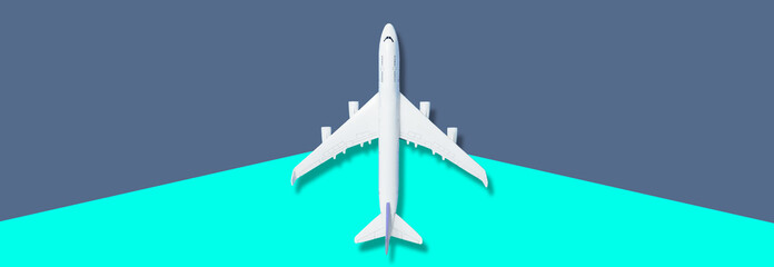 Airplane model. White plane on background. Travel vacation concept. Summer background. Flat lay, top view, copy space.