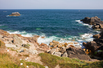 Fototapeta na wymiar Surf in Piper's Hole, Outer Head, Peninnis Head, St. Mary's, Isles of Scilly, UK