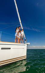 Hispanic family enjoying vacation together on private yacht