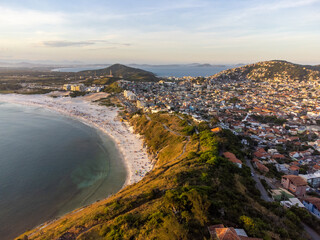 Arraial do Cabo, Rio de Janeiro, Brazil - red sunrise of wonderful paradise beach with white sands...