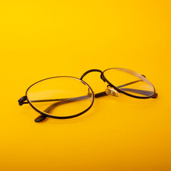 Eye glasses isolated on yellow background.