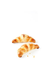 Flat lay home backed fresh French croissants isolated on white background