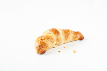 Flat lay home backed fresh French croissant isolated on white background