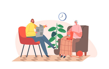 Young Woman Volunteer or Daughter Reading Newspaper to Aged lady Enjoying Knitwork. Senior Sitting on Armchair