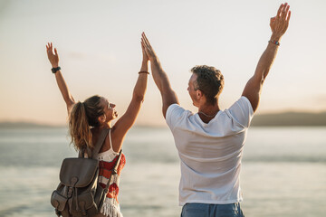 Couple Having Fun And Enjoying Summer Vacation At The Beach