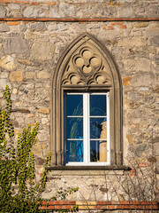Fototapeta na wymiar Wonderful old facade with window and ornament above the window