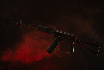 kalashnikov assault rifle in smoke