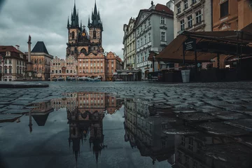 Fotobehang The Old Town Square is surrounded by historic buildings, of which the Týn Cathedral stands out. Its construction took place from the middle of the 14th century to the first decades of the 16th century © Petr
