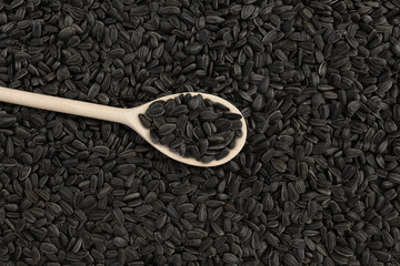 background of black sunflower seeds, close up