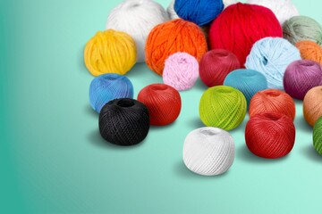 Skeins of yarn. Knitting needles, colorful threads. Knitting yarn for handmade winter clothes.