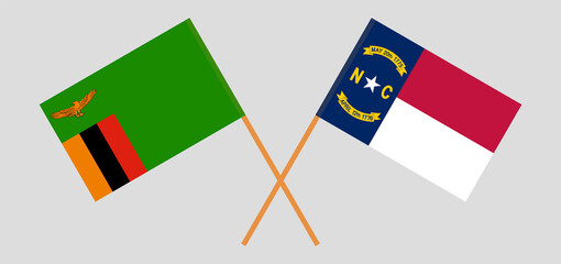 Crossed flags of Zambia and The State of North Carolina. Official colors. Correct proportion