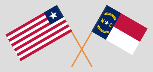 Crossed flags of Liberia and The State of North Carolina. Official colors. Correct proportion