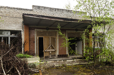 Fototapeta na wymiar Abandoned white brick houses. Forgotten, abandoned ghost town Skrunda, Latvia. Former Soviet army radar station.