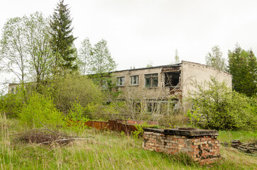 Abandoned white brick houses. Forgotten, abandoned ghost town Skrunda, Latvia. Former Soviet army radar station.