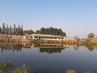 A School reflecting in a lake 