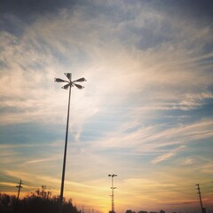 Lighting pole with sky and clouds sunset