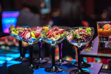 Decorated catering banquet table with different food snacks and appetizers with sandwich