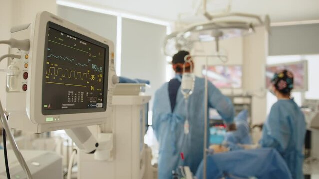 Monitors in intensive care unit. Heart beat of a patient on the screen of computers during operation in the hospital. Healthcare concept. Health monitor show normal vital signs of a patient