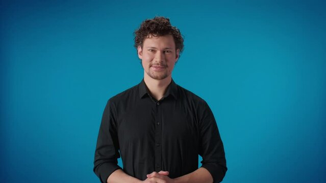 Fashion happy business male pointing forefinger exactly idea gesture posing isolated blue studio