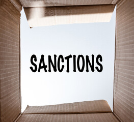 word Sanctions written on paper. the concept on the topic of sanctions in Russia